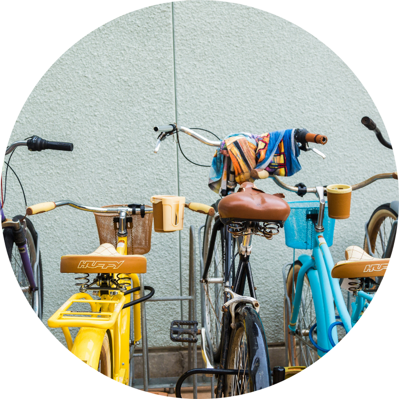 This is a picture of colorful bikes on a bike rack.