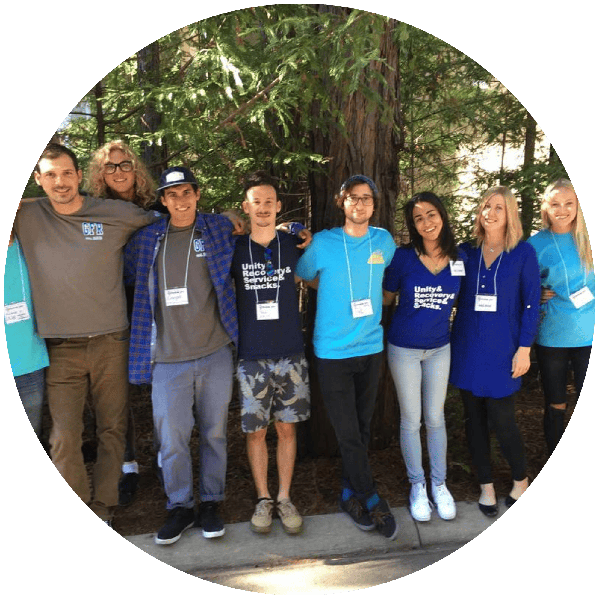 Photo of GFR Peers standing in front of a beautiful tree