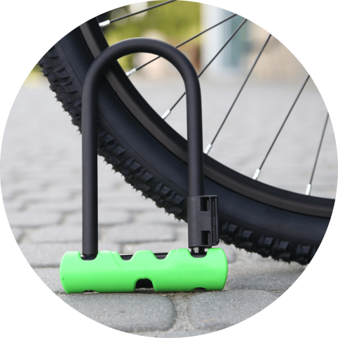 Picture of a U Shaped Bike Lock next to a pedal